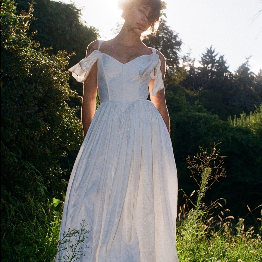 White satin sleeveless wedding dress with corset back